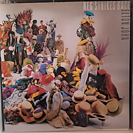 ELTON JOHN * REG STRIKES BACK